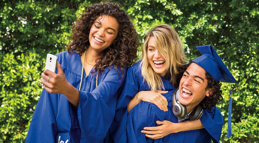 Three girls in graduation gowns