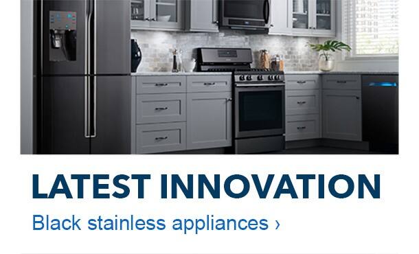 Latest innovation. Black stainless steel appliances. Kitchen with black stainless steel appliance suite.