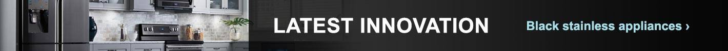 Latest innovation. Black stainless steel appliances. Kitchen with black stainless steel appliance suite.