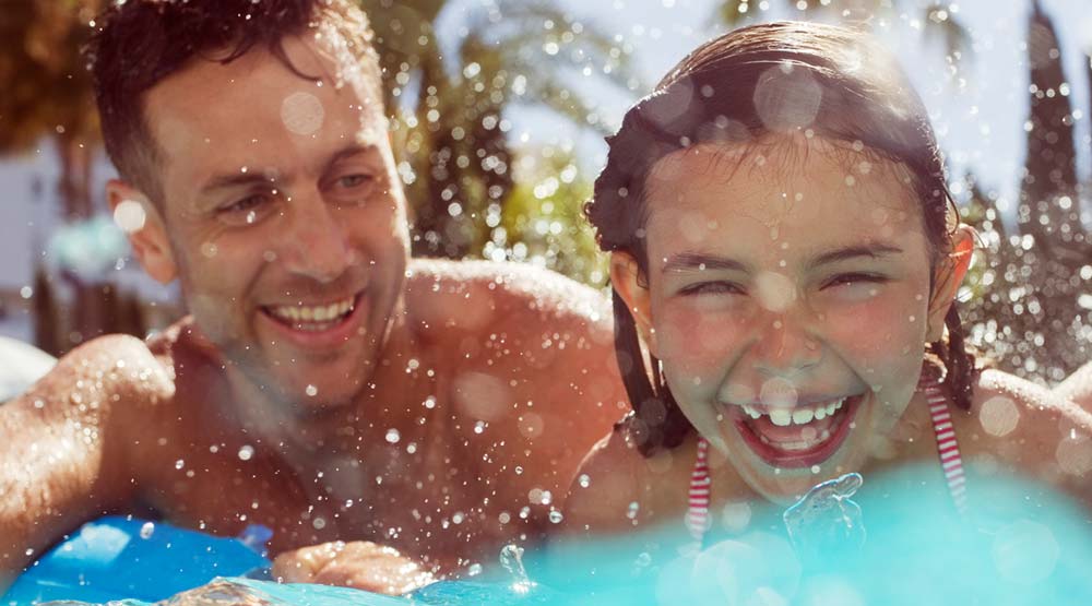 Man and child swimming