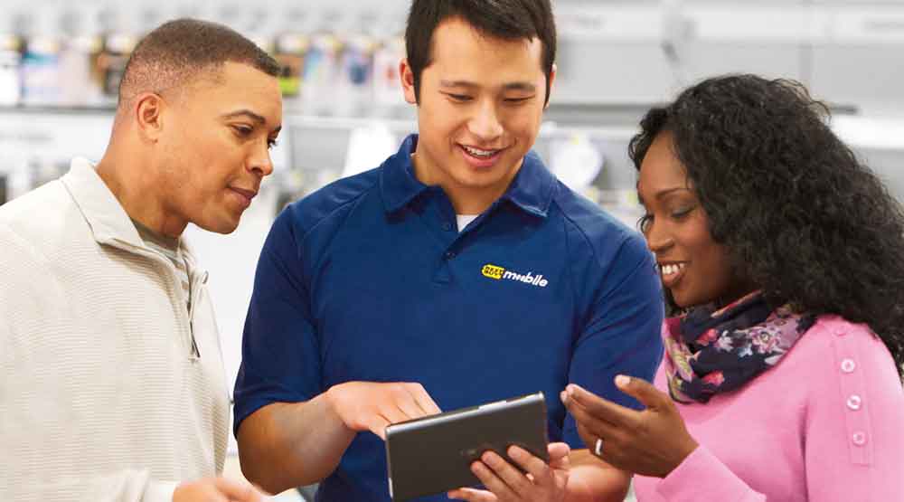 Blue Shirt helping customers