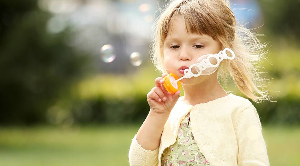 Girl blowing bubbles