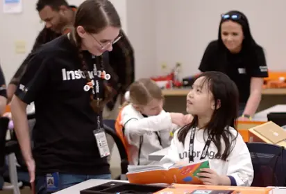Girl learning about technology at Geek Squad Academy.