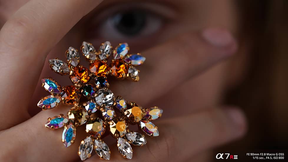 Ring on finger shot with Sony a7R III camera and FE 90 mm F2.8 Macro G OSS lens at 1/15 second shutter speed, f4.5 aperture and ISO 800 sensitivity