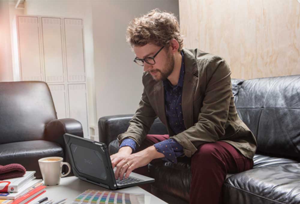 Man typing on laptop