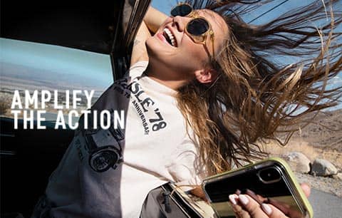 Woman holding phone, amplify the action