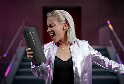 Woman holding speaker