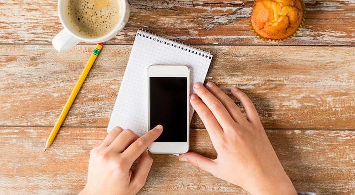 hands holding cell phone