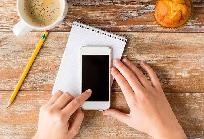 hands holding cell phone