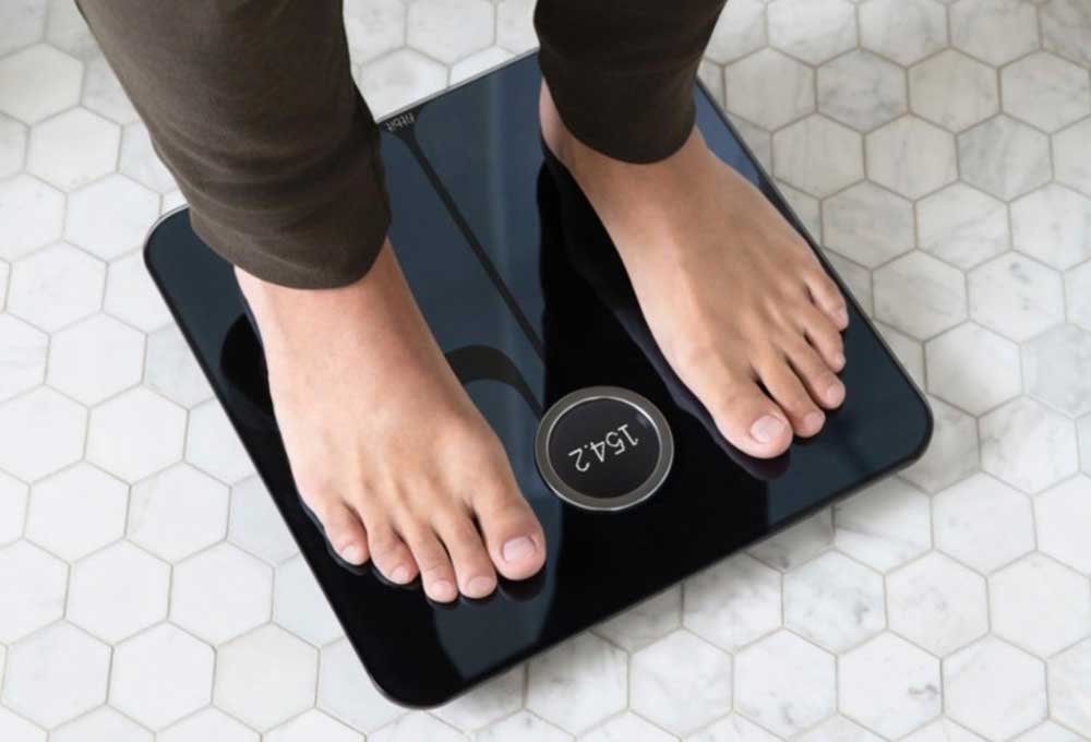Woman on bathroom scale