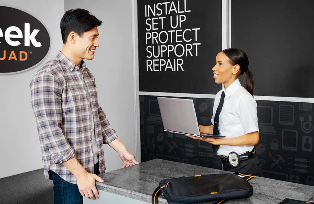 Geek Squad Agent with client.