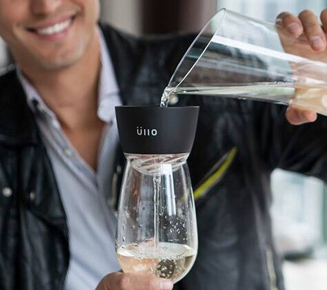 Person filtering wine