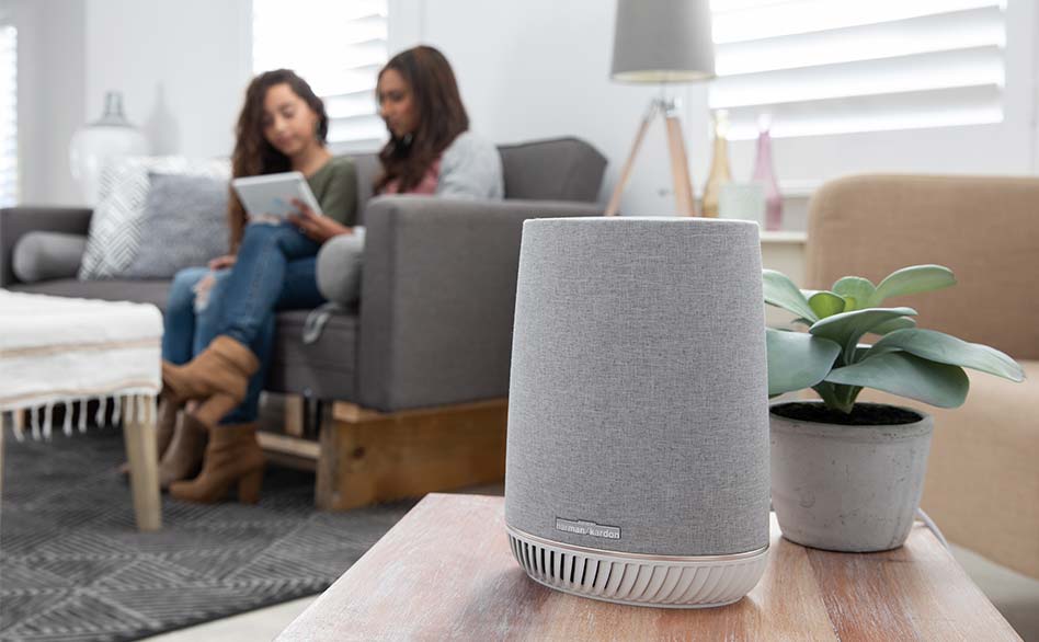 People reading near smart speaker