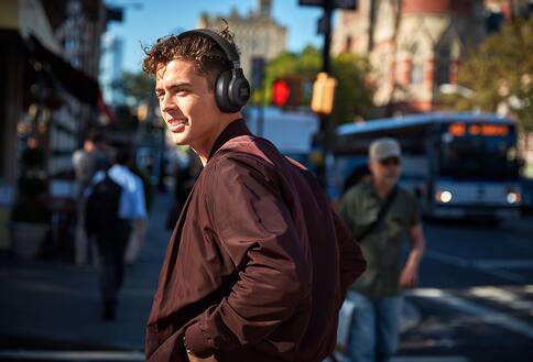 Man wearing headphones on city street