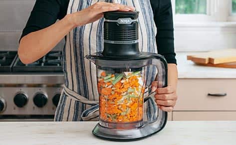 Person using food processor