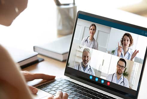 Person on a video call with four medical professionals