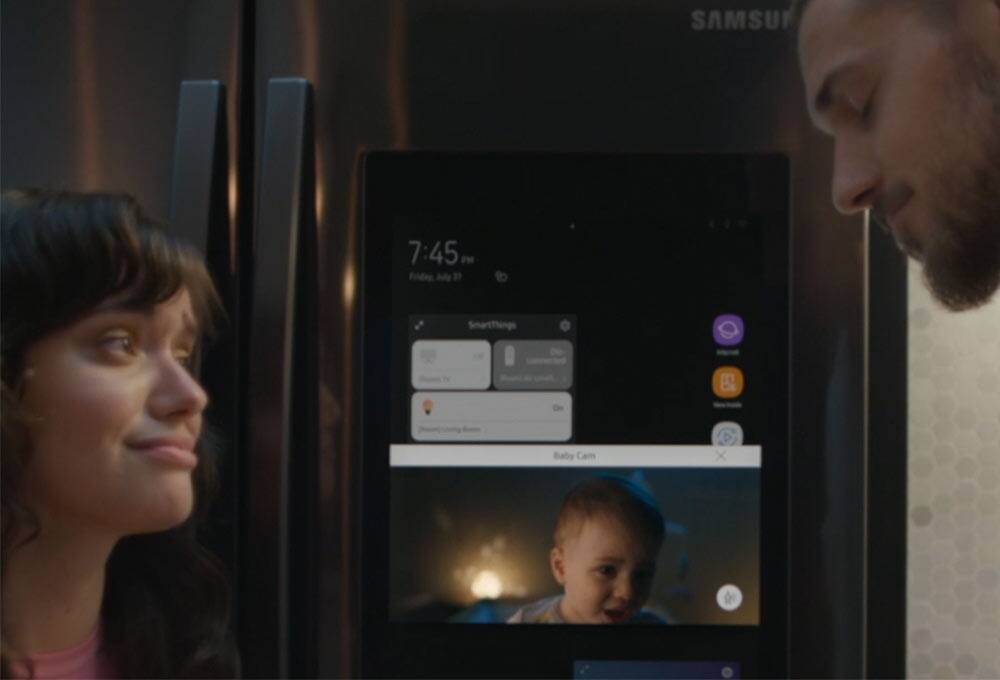 People standing in front of refrigerator