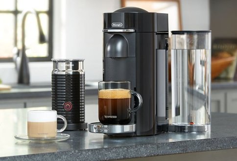 Kitchen counter with coffee maker, milk frother and coffee drinks