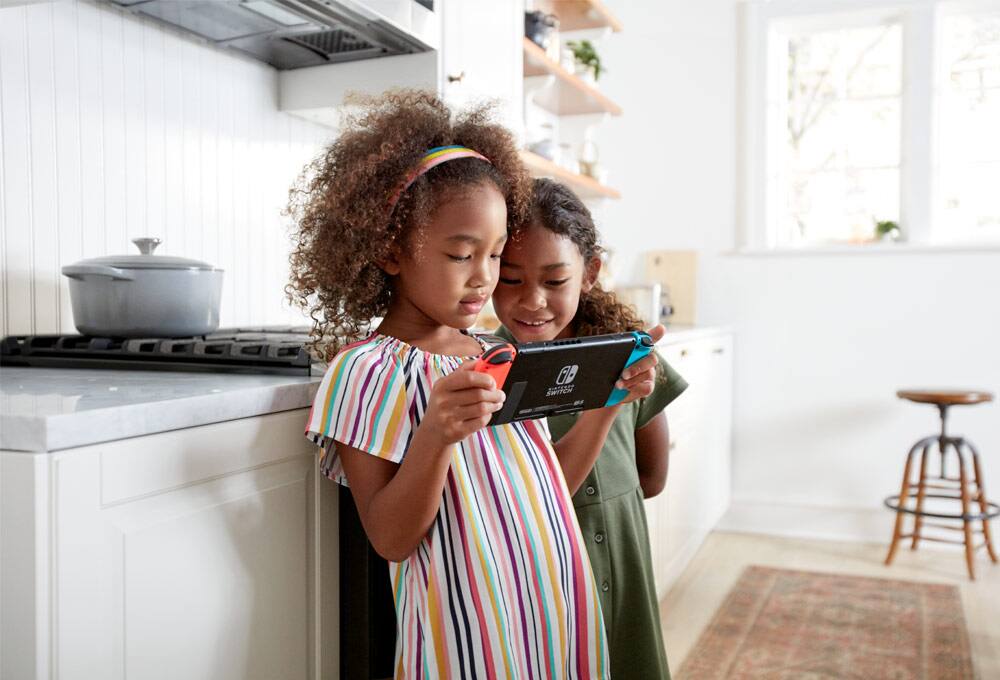 Parents and children playing video games together