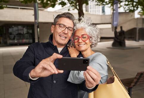 Couple looking at cell phone