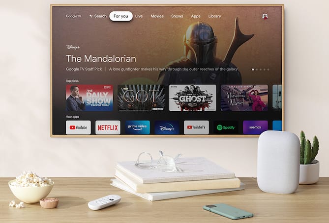 TV with streaming menu and smart speaker in living space