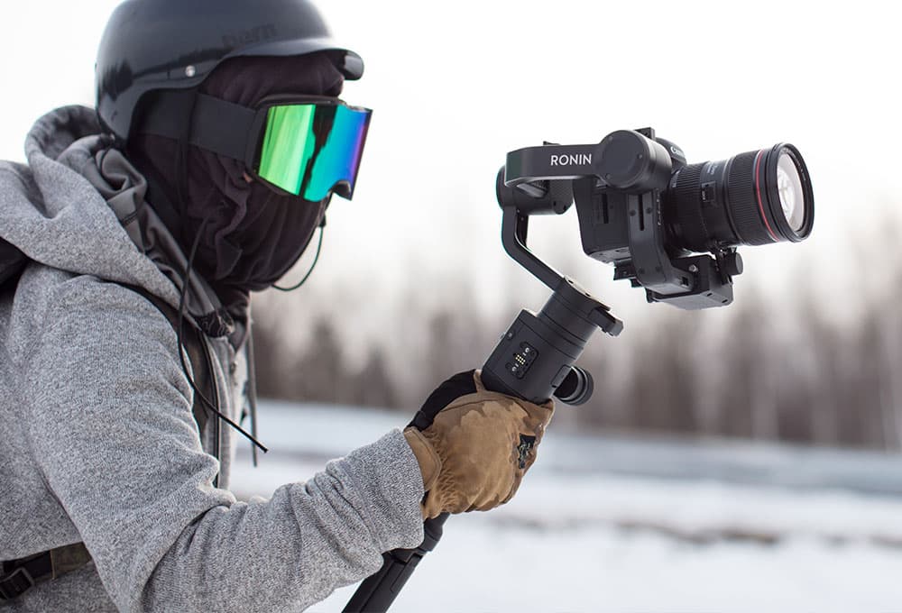 Snowboarder with camera on stabilizer