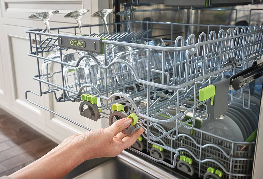 Person adjusting dishwasher rack