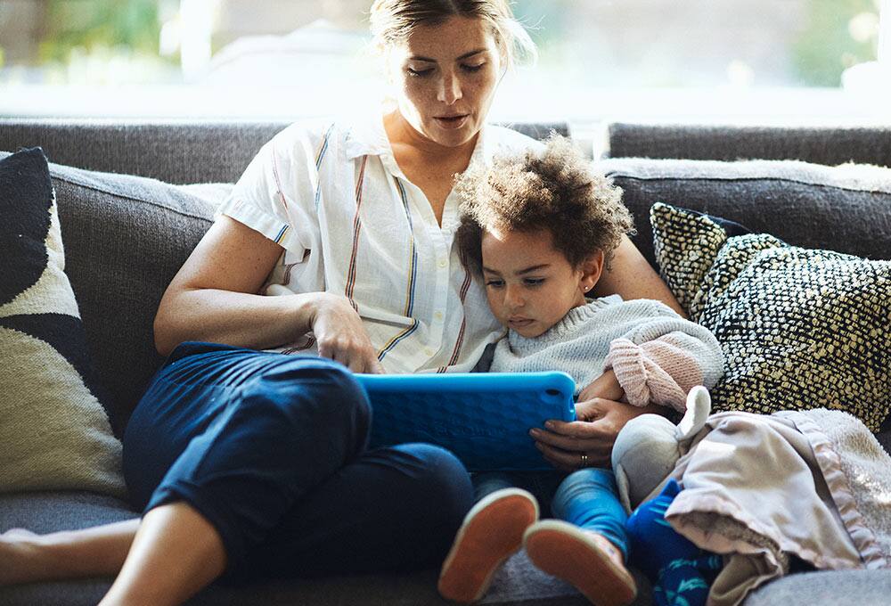 Mom and daughter on couch
