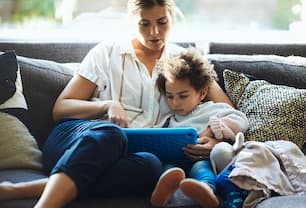 Mom and daughter on couch