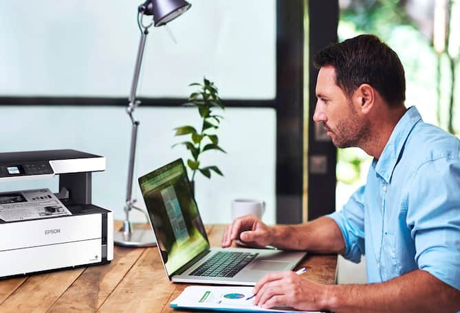 Man working on computer at desk
