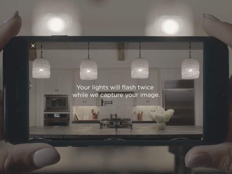 Smartphone displaying lighting controls, Your lights will flash twice while we capture your image
