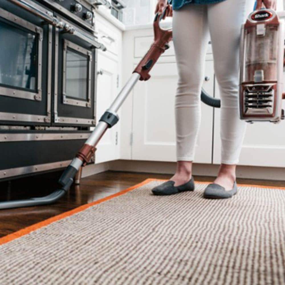 Person vacuuming