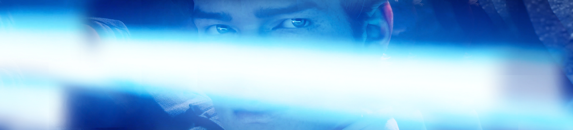 Young man's face lit up by blue laser sword