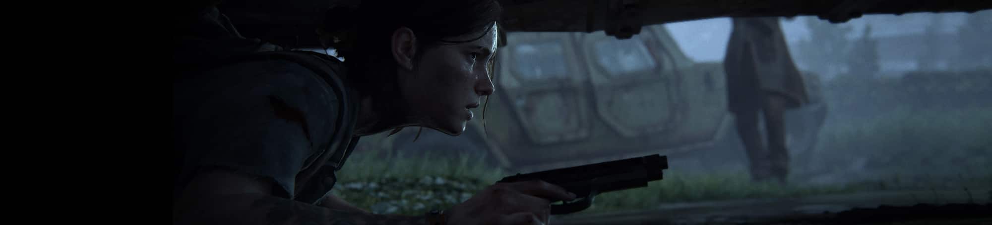 Woman holding gun hiding under car