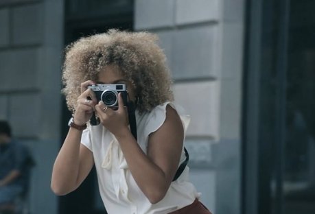 Woman taking photograph