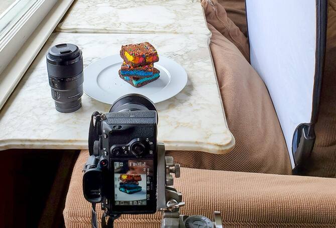 Camera filming food on table