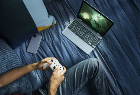 Person playing video games on tablet