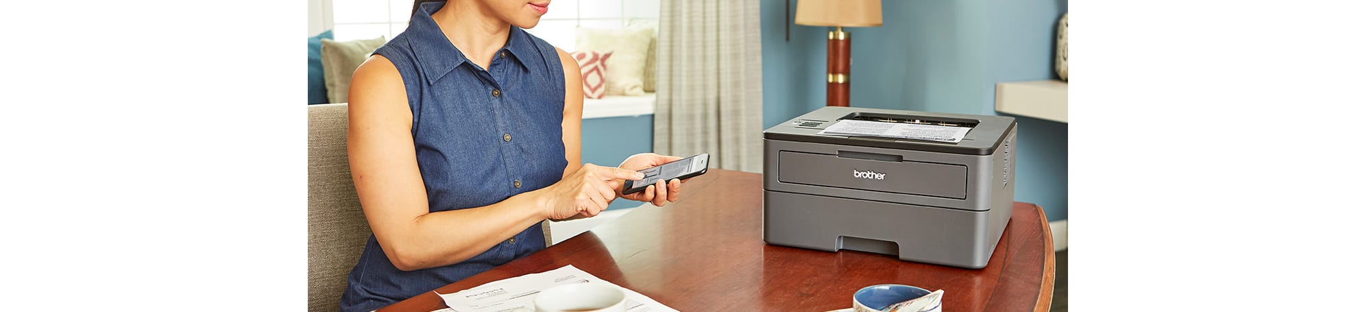 Woman at table printing documents