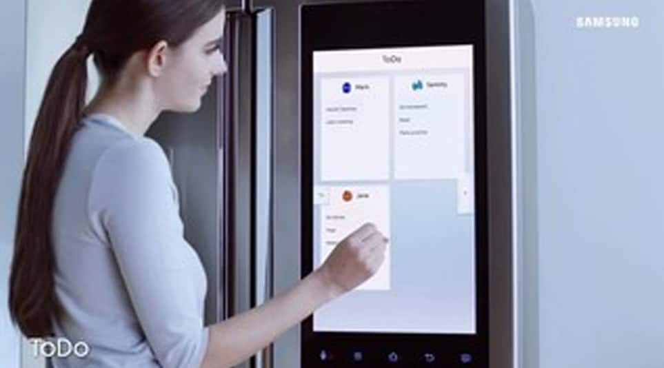 Woman looking at refrigerator