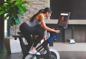 Woman riding stationary bike