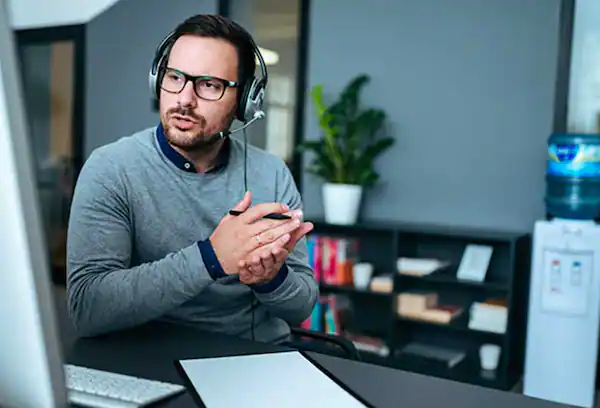 Man in an office answering a call