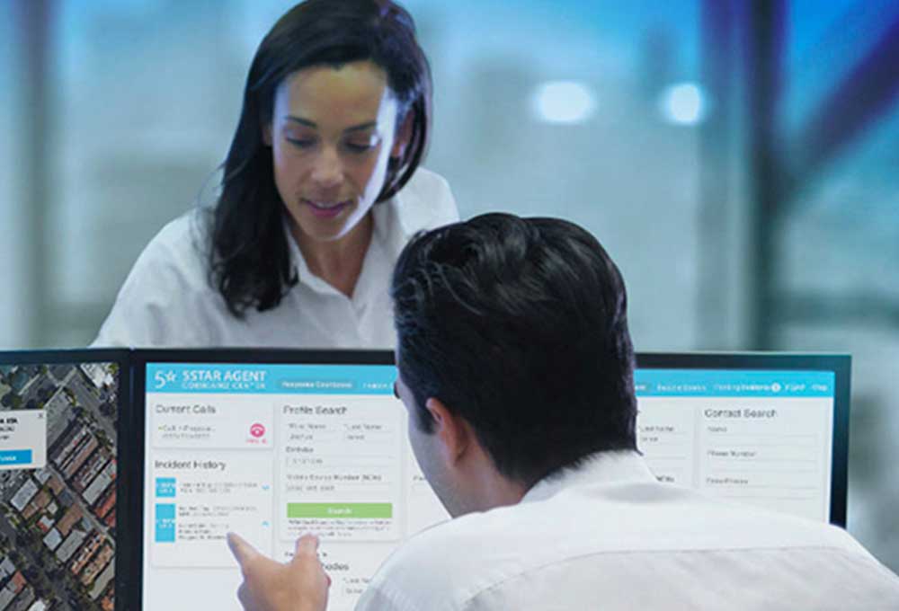 Care providers discussing over a computer