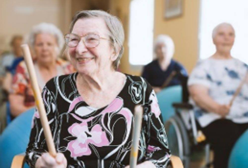 Seniors in a group music activity