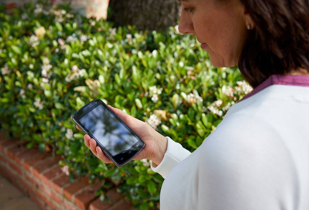 Woman outdoors using a smart phone