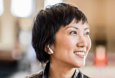 Woman wearing earbuds