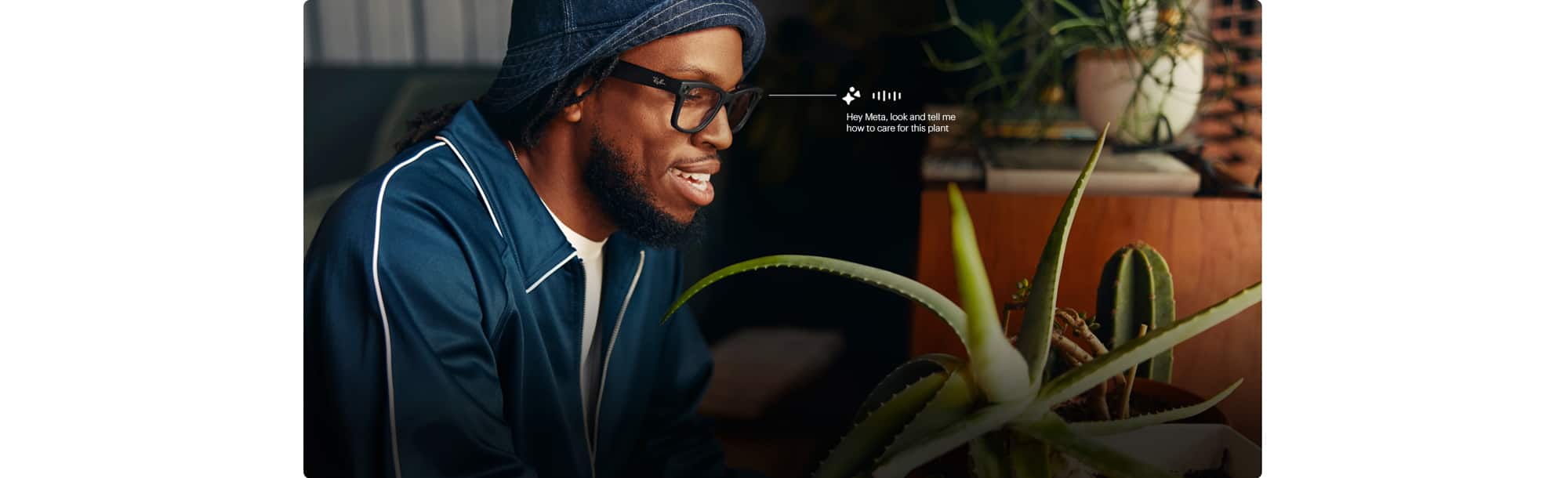 Man in glasses looking at a plant asks “Hey Meta, look and tell me how to care for this plant.”
