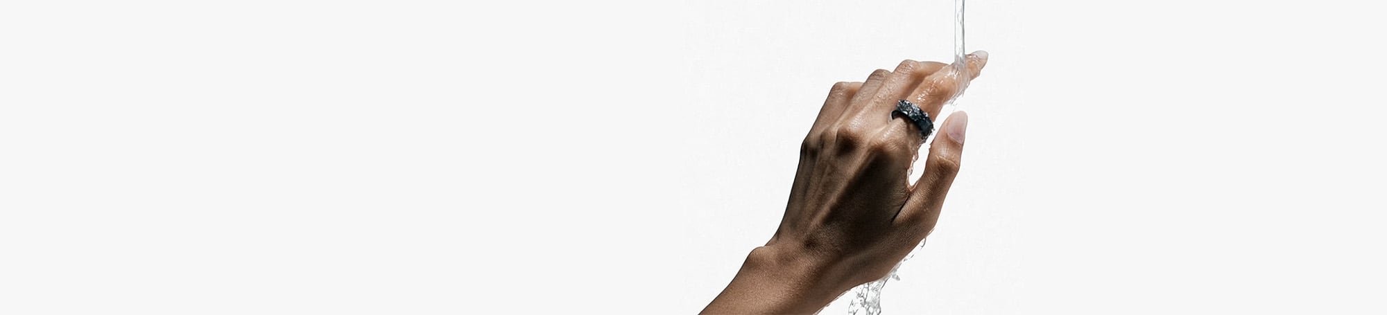 Person wearing smart ring in water