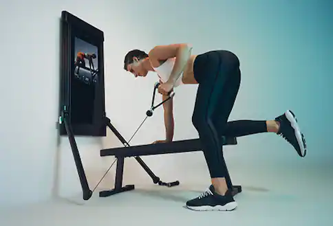 Person using home gym system