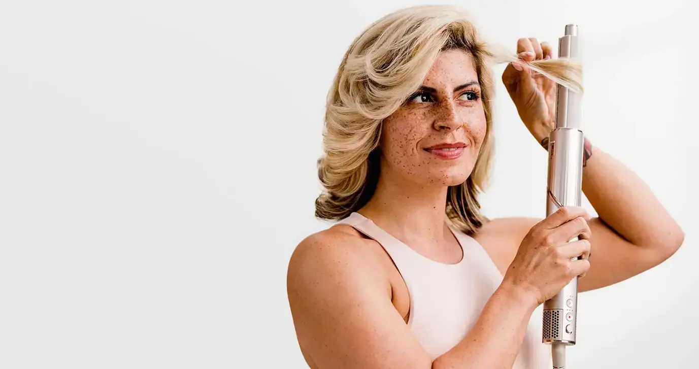 Person using hair care product
