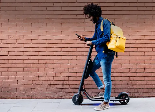 Scooter, backpack and phone